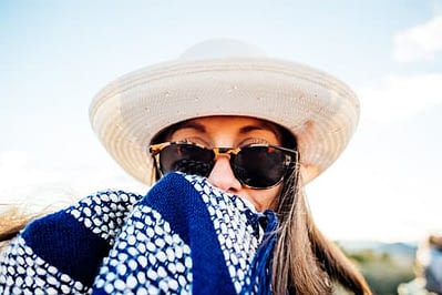 woman covered in clothing to protect from the sun