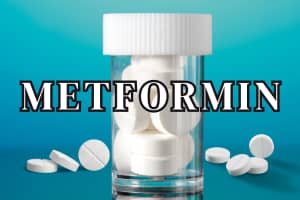 Metformin white pills in a bottle