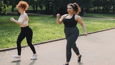2 women on activewear walking