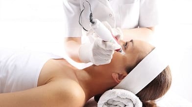 woman getting a microneedling treatment